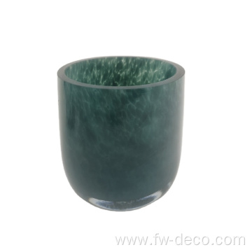 green patterned glass candle holder